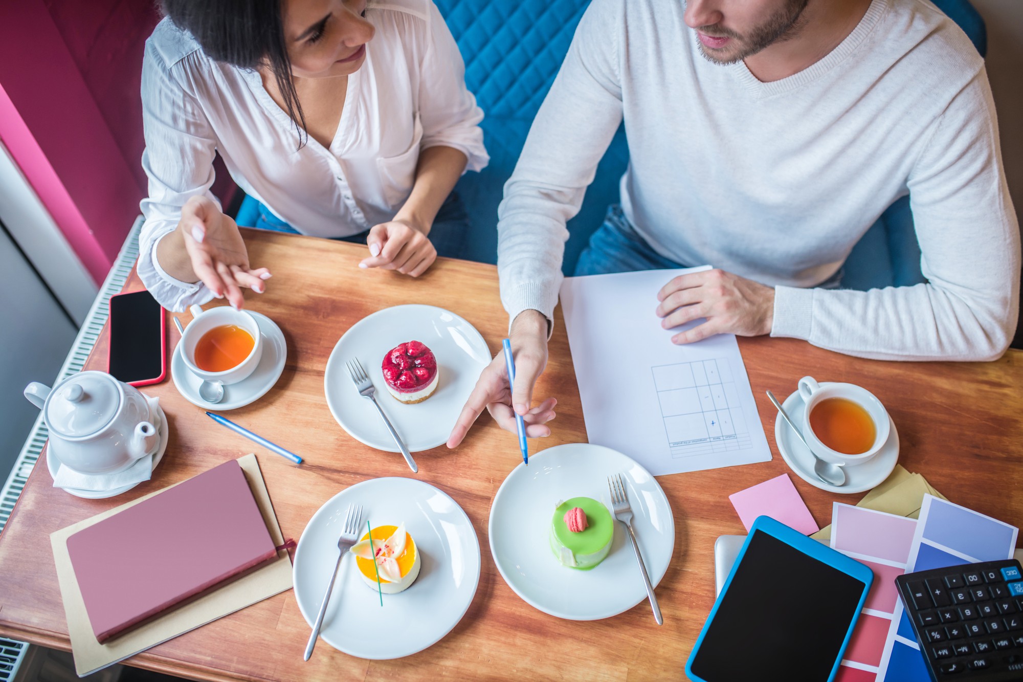 consultation over plated food and notes